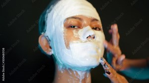 Plaster prosthetic process by a makeup artist on a waiting model, closeup Stock Video