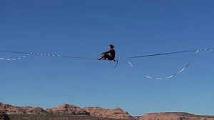 clip-3717625897-slacklining-over-canyon-moab-utah-showcasing-adventurous