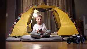 boy plays with remote control of a toy car, truck. radio-controlled car