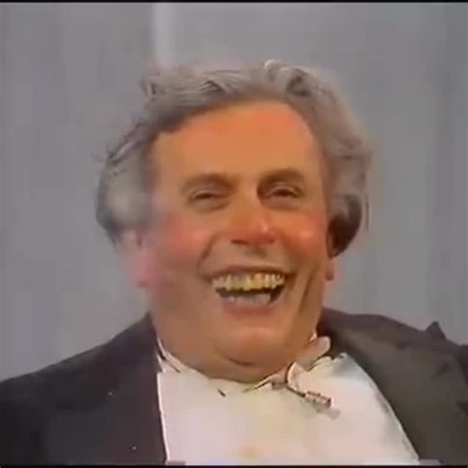 Gabriel Stüve on Instagram: "This chaotic moment is Sir Les Patterson — the outrageously wild character created by Barry Humphries — in a 1982 performance. Sir Les was famous for pushing every boundary of taste, turning discomfort into laughter through shock, exaggeration, and brilliant comedic timing. His comedy works as satire: he amplifies bad behaviour so much that we suddenly see our own social norms more clearly. Humour becomes a mirror — just distorted enough for us to laugh, release tens