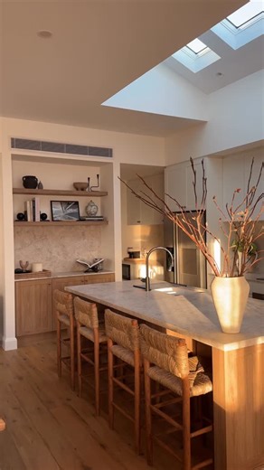 JESS DOVER on Instagram: "The morning light in our kitchen 🥹 I had so many replies to this story about kitchen details, popping them below again for you: Island Cabinetry: Surano Oak @polytec Shaker profile White Cabinetry: Natural white @polytec Shaker profile Stone: Turko Argento @signorinotilegallery Handles: Tropez Pull in aged brass from @loandcointeriors Sink: Vienna Double sink @thesource.est Taps: Prime range @novas.au Flooring: Carbonised Oak @woodcut_aus Kitchen stools: @racheldonath_