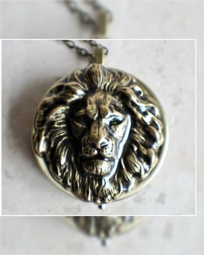 Lion music box locket, round locket with music box inside, in bronze with lion.