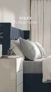 Unwind in style with the Foley TV Bed!✨ Whether you love to game in bed or catch up on your favourite shows before some shut eye, the Foley features a high-quality LG SMART TV discreetly tucked away in its foot end to keep you entertained 🙌 The high headboard is complete with cocooning winged sides in a super soft velvet finish, so you’ll feel instantly cosy when it’s time to wind down 😌 | Dreams Beds
