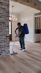 @wjhardwooddesigns keeps it so fresh and so clean with the Bona DCS Back Vac! Vacuuming and tacking between each sanding step and each coat can minimize grain raise and increase the probability of getting the smoothest possible topcoats. How do you keep your floors clean throughout the sand and finish process? Share your tips below! 👇 | Bona US Professional
