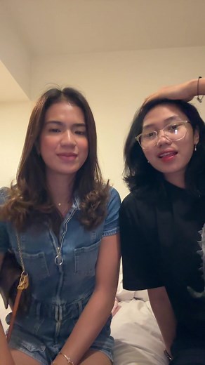 Casual Conversation Between Friends on a Bed