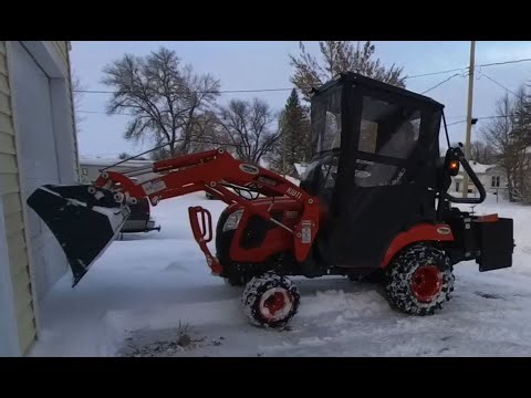 Snow removal job with the Kioti CS2520
