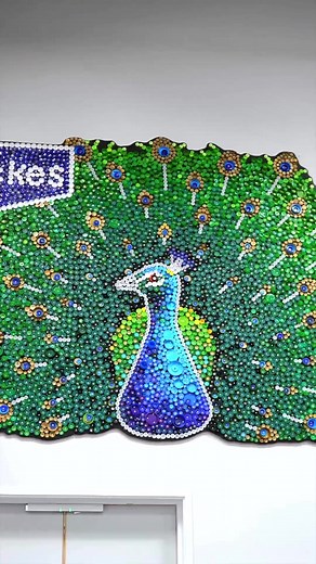 From bottle caps to a bold community peacock mural🦚 As part of our Wickes Community Programme, @Plastic Shed transformed thousands of collected bottle caps into a striking mural in our Dunfermline store, with bottle caps collected from local schools! Launch day brought everyone together, including the Peacocks in Pittencrieff Park Sanctuary (Dunfermline store’s first community project supported) and the Provost of Fife, to celebrate the reveal and the story behind it. It was a great chance to l