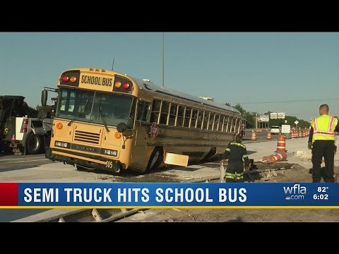 Semi truck hits school bus