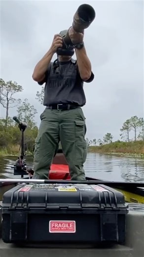 Wildlife photographer selfie canoeing through the Okefenokee National Wildlife Refuge, Georgia