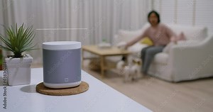 Asia cheerful woman urban people walk enter to dark night indoor room command ask AI turn on or turn off device. IOT device smart home solution app cloud computing system for future safety city life.