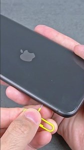 How to remove a SIM card from a smartphone using a paperclip