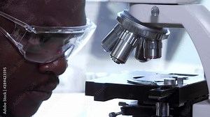African-american scientist working in lab. Doctor making microbiology research. Biotechnology, chemistry, bacteriology, virology, dna and health care.