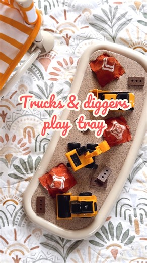 4.8K views | A tiny worksite for curious hands  Coffee grains turn into sensory soil ☕️, little wheels carve tracks ️, and bright diggers roam free  A simple tray that keeps busy minds exploring, building, scooping, and imagining  #sensoryplay #trucksanddiggers #playtrayideas #finemotorskills #babyplay #toddlerplay #playideas | Izimini | Facebook