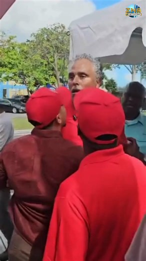 Tempers flared among representatives of the Progressive Liberal Party and the Free National Movement outside the Kendal Isaacs Gymnasium earlier today. FNM Candidate for Garden Hills, Rick Fox was captured on video being restrained by FNM agents. *Video has no sound*