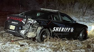 Kewaunee County Sheriff's Department squad car hit while on side of road