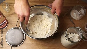 Fast motion footage of full process of mixing flour with ingredients and kneading a nice dough for bakery