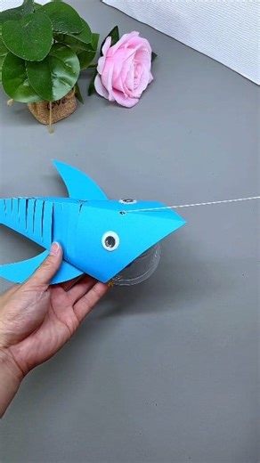 The blue fish with a line made of cardboard will run out by itself when you gently pull it. The method is simple and the finished product is interesting and fun. | Art, Crafts and Journals