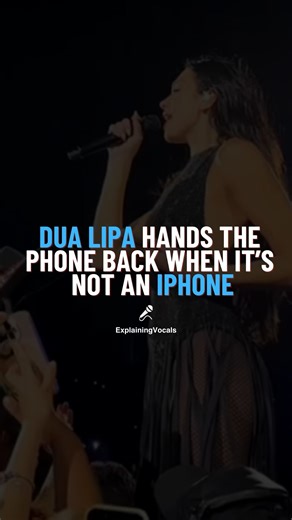 Explaining Vocals | Science of the human voice on Instagram: "Dua Lipa might be a global superstar… but her fan selfie moments are pure comedy gold 😂🔥 During her Radical Optimism Tour, one hilarious moment went viral when Dua grabbed a fan’s phone mid-performance to take a selfie — only to realize it wasn’t an iPhone. The split-second shock, exaggerated disgust, and dramatic “nope” face had the entire crowd screaming while the internet joked, “iPhone privilege confirmed” 😭📱. It’s that perfec