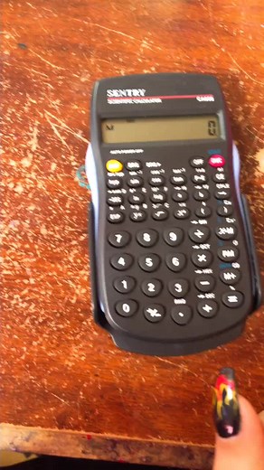 Scientific Calculator Demonstration with Colorful Nails