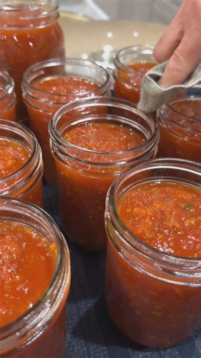 This is the best trick ever. Freeze your tomatoes whole- I did mine in gallon size zip lock bags but you can also freeze them on a tray. Then run them under hot water and the peel slips right off! My mom and SIL helped me make 34 jars of salsa 💃 😅 bless them. #canning #homestead #homesteading #foodpreservation #homemadesalsa | Kenzie Staheli