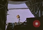 1965 – United States USA: C-130 Tactical Airlift aircraft demonstrate Low Altitude Parachute Extraction System.