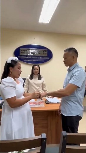 A loving couple exchanged vows during a simple wedding ceremony by Mayor Tessa Constantino.