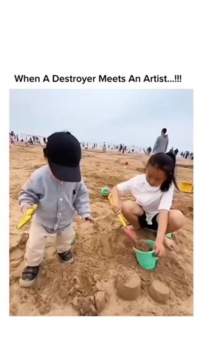 sosuua.io on Instagram: "The video captures a young girl meticulously building sandcastles on a beach, disrupted by her toddler brother who knocks them down repeatedly, leading to her pinning him and swatting his back multiple times amid his cries, embodying chaotic sibling play. Shared on January 1, 2026, by @AnayaSpirit"