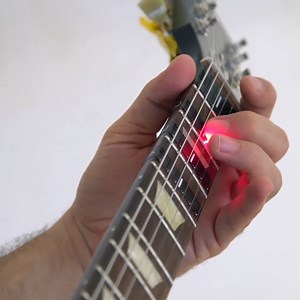 491K views · 1.4K reactions | This device will teach you how to play the guitar. | Verge Reviews | Facebook