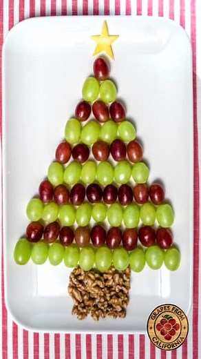 Here's a healthy and creative Christmas snack/appetizer idea featuring fresh Grapes from California! Assemble California grapes in the shape of a Christmas tree, using cheese or fruit to create the star with a star-shaped cookie cutter, and any nut you prefer as the trunk on the bottom. Make sure you add this to your Christmas food list for next week...and go with Grapes from California! | Grapes From California