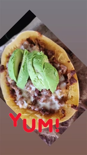 So delicious is right!! Spaghetti squash boats stuffed with beef, cheese and topped with avocado. #spaghettisquash #avocado #dinnertime #CoachCarmen #lifestylecoach
