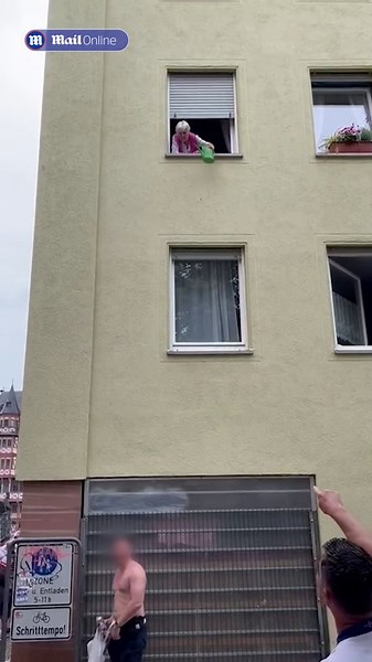 Pensioner pours water over football fan urinating by her front door