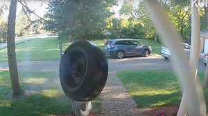 Here's What Happens When a Runaway Tire Meets a House at 65 MPH