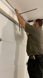 Fixing a garage door that had a broken spring. #HandsomeOrHandy #Handyman #GarageDoorMaintenance | Anthony Reimnitz