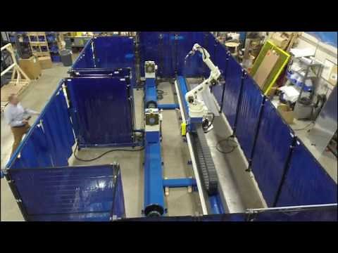 LT-ARC production robotic welding cell with dual headstock/tailstock stations