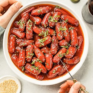 7K views · 11 reactions | These SLOW COOKER HONEY SRIRACHA LITTLE SMOKIES are crazy addictive & ridiculously easy to make thanks to the crockpot! Full of sweet and spicy flavor, these mini cocktail sausages are perfect for barbecues, potlucks and parties! Printable Recipe: https://www.nospoonnecessary.com/slow-cooker-honey-sriracha-little-smokies/ | No Spoon Necessary - Unique Seasonal Recipes | Facebook