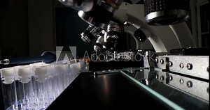 Closeup of observing magnification of lens of scientific microscope in laboratory. Types of laboratory microscope optical system and medical analyzes concept