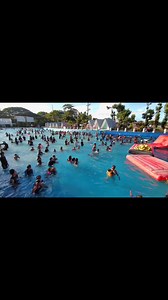 The wave pool at Splash Island is called *Agos Grandes*. It's a popular attraction that generates waves, providing a fun and exciting experience for visitors. The wave pool is designed for swimming and playing in the simulated ocean waves. | SPLASH ISLAND