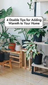 We asked interior designers for their top tips for adding warmth to your home. For more home decor tips to help you lean into cozy living this winter, tap the link in our bio. #TheSpruce #cozyhome #interiordecorating #roominspiration #interiorstyling #cozyroom - Image credits; Thumbnail, bathroom image, brown white living room: Spruce Originals Gray couch living room image: KatarzynaBialasiewicz from Getty Images Potted plants image: Huy Phan from Pexels | The Spruce