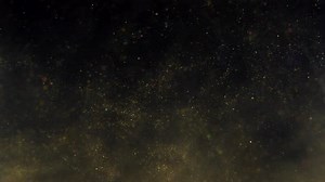 Golden Dust Particles in Motion