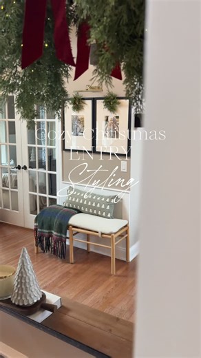 Kristen | Home Decor & Lifestyle on Instagram: "Cozy Christmas entry styling for small spaces! 🤍 If you have a tiny entry wall or no real foyer, this is my favorite way to make it feel warm, festive, and pulled together for the holidays. A simple bench, lumbar pillow, cozy blanket, picture frames, and a picture light is my go-to solution. These simple layers always come together beautifully without feeling overdone. 🎄✨ See something you love? Follow @khuff_home and comment SHOP for the details