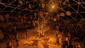 Inside post-apocalyptic festival  where revelers party in Mad Max-style world