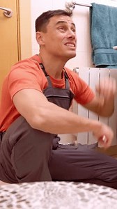 Plumber evaluating bathroom sink issue and explaining costs to customer