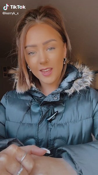 Stylish Winter Fashion: Black Coat with Fur Hood