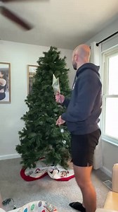 This woman decided to shift the Christmas tree a bit to make wrapping the lights easier. Her husband noticed she was getting too close to the ceiling fan and told her to stop, but she ignored his warning and kept going. As a result, the fan knocke... | Jukin Copyright Management