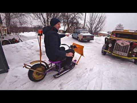 Electric Snow Grader. Cleans Rapidly