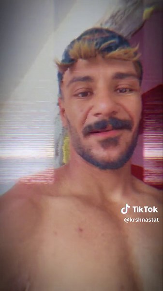 Muscular Male Applying Paint for Body Art