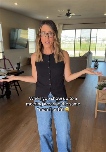 The Working Mom Uniform: Jeans, Black Top, and Sandals