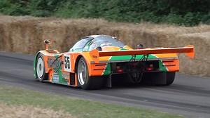 Classic Mazda 787B pushing through a high speed course
