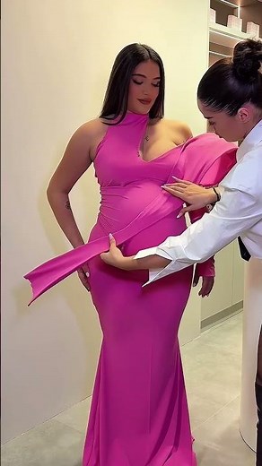 Share with a friend who would own the spotlight in this fuchsia layered maternity gown! To order,