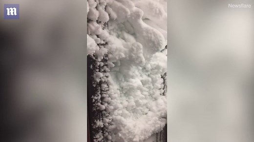 Roaring blizzard completely covers house in thick snow in Iceland